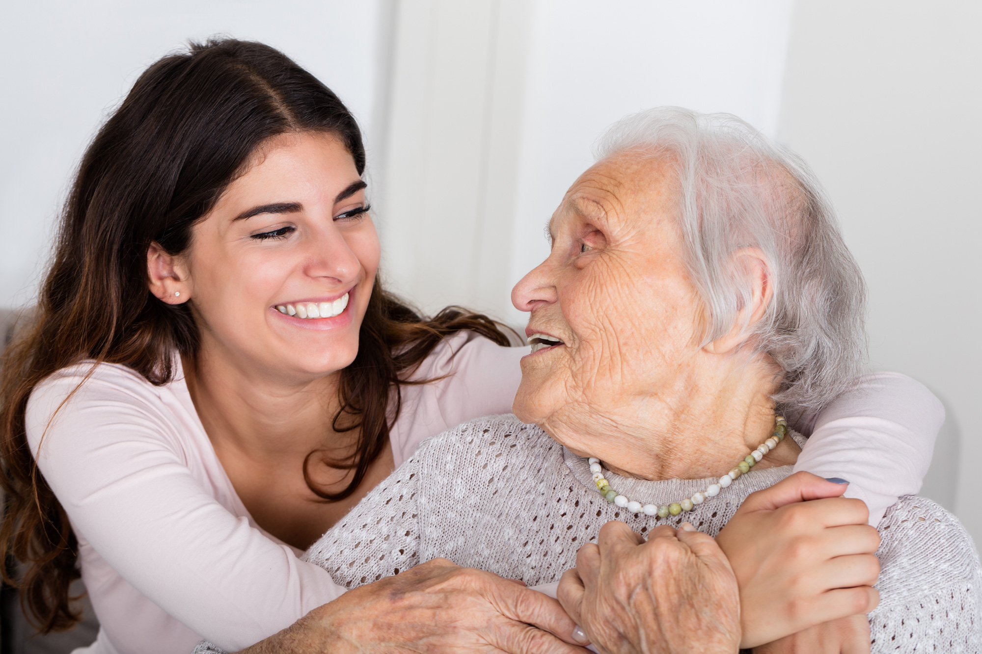 loving-embrace Loving Embrace between young lady and elderly woman